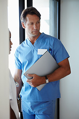 Image showing Man, nurse and documents for hospital healthcare or medical insurance for diagnosis, paperwork or scrubs. Male person, planning and research folder or professional career, workplace or administration