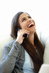 Image showing Phone call, funny and laughing woman, smartphone and couch at home for relax. Joke, comic and conversation on cellphone or technology for social female person, mobile networking or humour on sofa