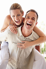 Image showing Happy couple, portrait and piggyback with excited, fun and bonding at home for holiday or vacation. Funny man and woman laughing together, support and play games or energy with romance and care