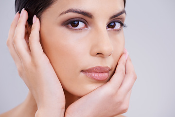 Image showing Woman, hands and beauty portrait for skincare, dermatology and shine with cosmetics isolated on white background. Makeup, transformation and healthy glow for skin, wellness and self care in studio