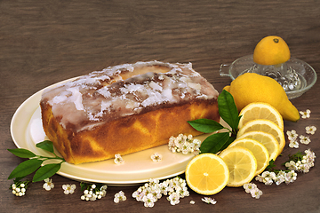 Image showing Lemon Drizzle Cake with Fruit and Spring Blossom Flowers