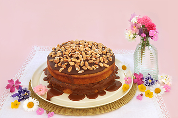 Image showing Peanut and Caramel Sauce Cake with Summer Flowers