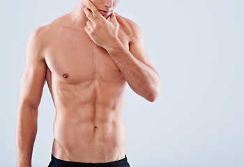 Image showing Man, muscle and health skincare in studio with fitness abs on white background for transformation, self care or confidence. Male person, stomach and wellness on mockup space, chest or dermatology