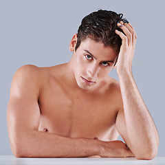 Image showing Man, portrait and skincare health in studio or facial treatment with dermatology, wellness or grey background. Male person, face and model with hand on mockup space for wellbeing, hygiene or pride