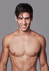 Image showing Man, portrait and muscle smile in studio for workout transformation or strong chest, grey background or bodybuilder. Male person, model and face on mockup space for fitness abs, wellness or health