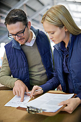 Image showing Business people, reading and checklist with inventory, storage or supply chain at warehouse. Coworkers, team or employees looking at documents, paperwork or clipboard for distribution at factory