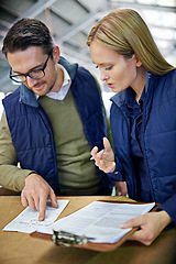 Image showing Business people, reading and checking inventory with storage in supply chain at warehouse. Logistic coworkers, team or employees looking at documents, paperwork or clipboard for distribution factory