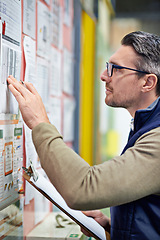 Image showing Warehouse, employee and man with clipboard, board and industry of shipping and manufacturing. Checklist, staff and male person with inventory for goods or stock in factory, job and logistics