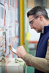 Image showing Warehouse, employee and man with clipboard, inspection and industry of shipping and manufacturing. Checklist, staff and male person with inventory for goods or stock in factory, job and freight