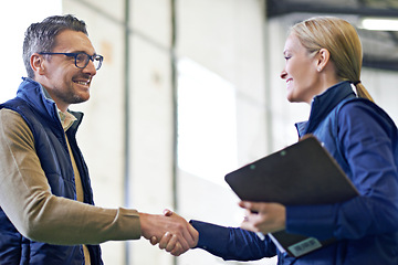 Image showing Business people, handshake and welcome for partnership, collaboration and agreement. Professional, clipboard and shaking hands for introduction, b2b onboarding or teamwork in shipping warehouse