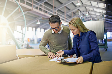 Image showing Business people, reading and checking inventory with storage for checklist in supply chain at warehouse. Coworkers or employees looking at documents, paperwork or clipboard in distribution at factory