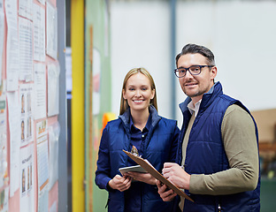 Image showing People, portrait and business checklist in warehouse with bulletin board for schedule or calendar for order details. Man, woman and clipboard for supplier information or notes, happy and together