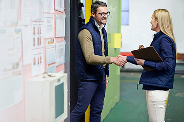 Image showing Handshake, business people and greeting for partnership, b2b collaboration and agreement. Professional, clipboard and shaking hands for introduction, onboarding or teamwork in shipping warehouse