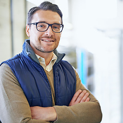 Image showing Logistics, portrait and businessman with arms crossed in warehouse for shipping, distribution or storage. Smile, factory and worker for confidence, supply chain or courier service in export industry