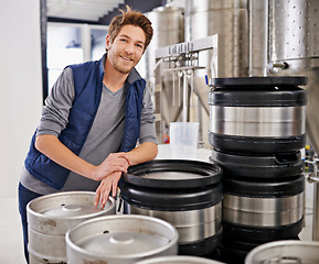 Image showing Brewery, man and portrait with tank in factory with confidence, pride and container machine for manufacturing. Industrial, worker and smile in distillery by metal equipment for brewing in warehouse