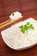 Image showing Bowl of rice on mat