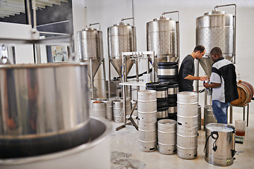 Image showing Brewery, production and people with steel in factory or distillery for winery, alcohol and drink manufacturing. Worker or winemaker checking metal tank, container or fermentation vessel for beer