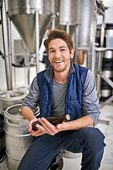 Image showing Man, brewery and craft beer in bottle with portrait at small business with production process in factory. Person, distillery and manufacturing by container, excited and pride with alcohol in workshop