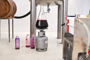 Image showing Winery equipment, glass container and wine production system with gas can in workshop. Manufacturing, canister and barrel with process at alcohol, distillery and pipe for liquid in industrial plant