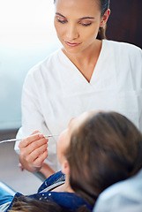 Image showing Dental, child and tool at dentist for healthcare with consultation, mouth inspection or cavity check for oral health. Orthodontics, kid patient or woman for teeth cleaning, gingivitis or medical care