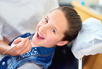 Image showing Girl, child and portrait at dentist for dental with healthcare tool, consultation or mouth inspection for oral health. Professional, kid patient or hand for teeth cleaning, gingivitis or medical care