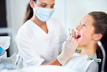 Image showing Girl, child and dental inspection at dentist with healthcare tool, consultation and safety mask for oral health. Professional, kid patient or glove hand for teeth cleaning, gingivitis or medical care