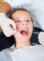 Image showing Girl, kid and mouth inspection at dentist for healthcare with dental tool, consultation or checkup for oral health. Expert, child patient and glove hand for teeth cleaning, gingivitis or medical care