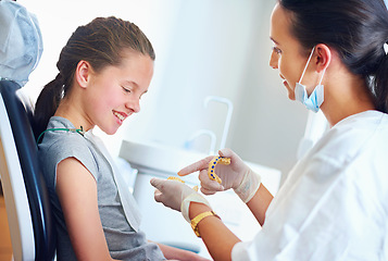 Image showing Child, dentist and patient for teeth whitening, oral healthcare and checkup for cleaning with assessment. Woman, girl or kid and happy for tooth, mouth and consultation for cavity or gingivitis