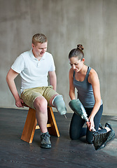 Image showing Physiotherapist, rehabilitation and prosthetic leg in clinic for support, physiotherapy, and exercise. Physical therapist, help and training person with disability for wellness, therapy and health