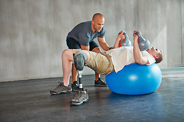 Image showing Physiotherapy, patient or man with disability and kettlebells for exercise at gym for recovery, strength and healthcare rehabilitation. Physiotherapist, help or support and consultation for amputee