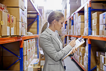 Image showing Writing, clipboard or business woman at a warehouse for logistics, planning or inventory. Admin, factory or employee with cargo, checklist or stock storage compliance documents for quality assurance