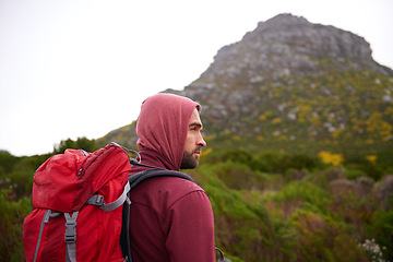 Image showing Man, hiking and mountain with backpack in nature, Germany trail on wildlife conservation. Active, male person on adventure for health and wellness, confident explorer on rocky terrain for sport