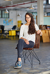 Image showing Business, woman and portrait with confidence in office for creative internship, relax and startup pride in chair. Entrepreneur, employee and serious in a warehouse workspace and coworking workplace