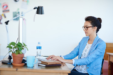 Image showing Business woman, typing and planning on computer for creative project, research and online editing or copywriting. Young professional editor, writer or person on desktop for job or startup newsletter