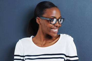 Image showing Glasses, thinking and black woman with smile, ideas or model on grey studio background. African person, mockup space or girl with solution or eyewear with wonder, decision or clear vision with choice