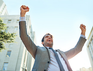 Image showing Corporate man, city and freedom or celebration for career success, winning and yes with arms up in sky. Low angle of a business worker or lawyer excited for opportunity, news and bonus or promotion