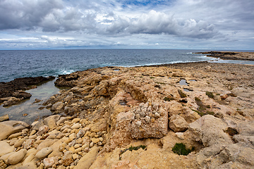 Image showing Qawra Point Beach with turquoise waters nearby. Malta