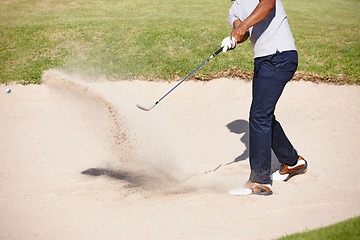 Image showing Man, golfer and swing on golf course in sand pit for par, stroke or strike on grass field in nature. Closeup of male person or sport player hitting ball out of dirt for point or tough outdoor shot