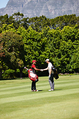 Image showing Man, friends and golfer with handshake for meeting, game or match together on grass field in nature. Male person, people or sports player shaking hands for teamwork, deal or agreement on golf course