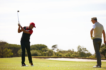 Image showing Man, friends and swing with club on golf course for stroke, point or strike on grass field in nature. Male person, sports player or golfer hitting ball for friendly game, match or outdoor competition