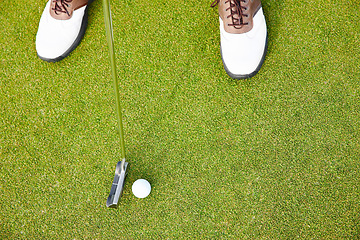 Image showing Shoes, club and golf ball for sports on field, training and practice for competition or tournament. Closeup, feet and driver for outdoor challenge and exercise, top view and professional athlete