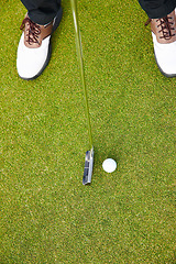 Image showing Feet, club and golf sports on field, training and practice for competition or tournament. Closeup, shoes and grass for outdoor challenge and exercise, top view and athlete for international contest