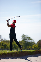 Image showing Man, swing and club for golf tournament on field, driver and international sports or contest. Black male person, athlete and equipment for practice, training and challenge in competition on technique