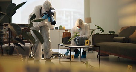 Image showing Crime scene, photography and people in house for evidence, investigation and inspection. Law enforcement, forensic analysis and police team take pictures in apartment of victim, murder and search