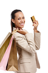 Image showing Woman, shopping bag and corporate credit card in portrait, business purchase and payment with sale on white background. Finance, company expense and discount at retail store with customer in studio