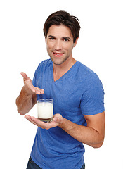 Image showing Man, portrait and milk for calcium in studio, dairy and milkshake for nutrition on white background. Male person, glass and proud of vanilla smoothie for diet, weight loss and organic vitamin d