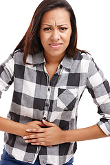 Image showing African woman and stomach pain in studio with upset or hurt, bellyache or digestive disorder. Female person, backdrop and acid reflux with hands on middle for cramp, uncomfortable or sore or sick