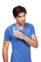 Image showing Man, portrait and glass of water in studio, thirsty and cold beverage for hydration on white background. Male person, mineral liquid and vitamins or confidence in nutrition, aqua and detox or diet