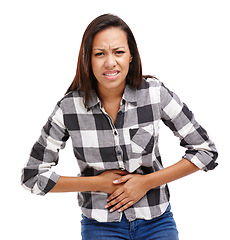 Image showing Woman, pain and portrait with hands on stomach, cramp and irritation in white background. Female person, gut health and medical condition for healthcare, wellness and medicine in studio backdrop