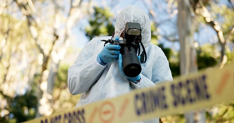 Image showing Csi, photographer and police tape at crime scene for investigation in forest with evidence and safety hazmat..Forensic quarantine, expert investigator and pictures for observation and case research